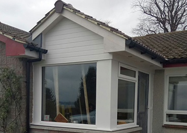 Porch extension which extends/enhance existing entrance area complete with a picture window